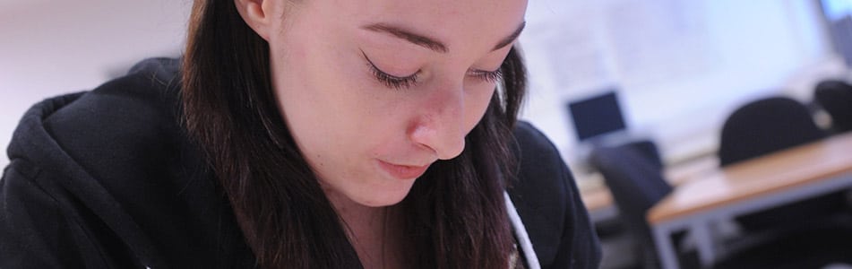 Female accounting student looking down